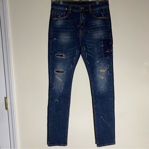 Men’s Patchy Distressed Paint Splatter Denim Jeans